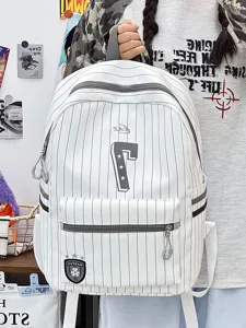 White striped canvas backpack, detailed view showing front zipper pocket and number seven design.