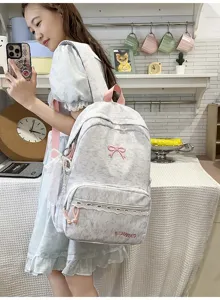 Leuke Japanse stijl schoolrugzak met roze strik en kantafwerking voor tienermeisjes en studenten.