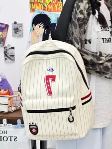 Casual striped canvas backpack detail shot showing front pocket and sporty number design.