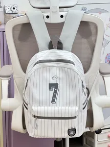 Detail view of a cute Japanese style pinstripe backpack with number print and front pocket.