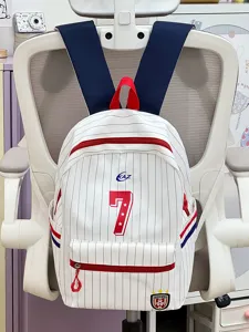 Detail view of the Japanese style pinstripe backpack showcasing red zipper and large number 7.