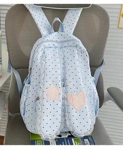 Sweet polka dot bunny ear backpack detail, cute lace trim and star heart patch design.