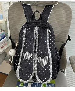 Sweet lace polka dot bunny ear backpack for girls, stylish student school bag with cute charms.
