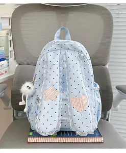 Sweet blue polka dot backpack with lace trim and cute bunny ear straps for students.