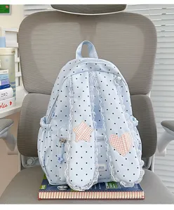 Sweet lace polka dot backpack detail showing bunny ear straps and star heart patches.