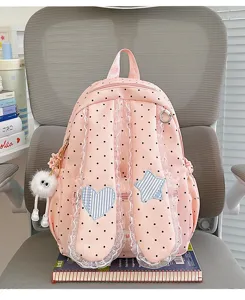 Sweet pink polka dot backpack detail featuring lace bunny ears and cute heart star patches.