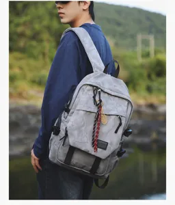 Sac à dos scolaire camouflage gris de grande capacité avec pendentif raquette de tennis.