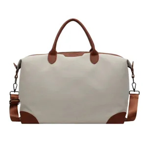Casual canvas reistas met bruine lederen afwerking, grote sporttas voor fitness en reizen.