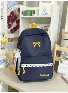 Trendy Japanse stijl marineblauwe rugzak met gele strik en kanten details voor studenten.