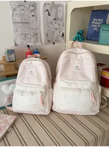 Schattige roze geruite schoolrugzak met schattige kantafwerking en geborduurde puppy.