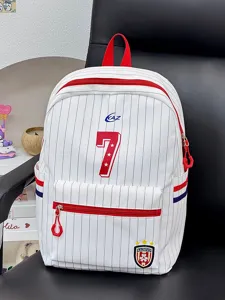 Close-up detail of the stylish Japanese striped backpack with red accents and spacious pockets.