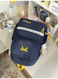 Leuke donkerblauwe Japanse stijl rugzak met strik borduurwerk en kanten afwerking.