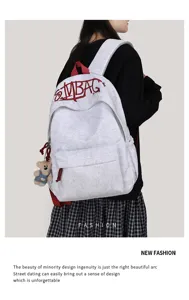 Casual large capacity canvas school backpack for women, lightweight commuting and travel bag.