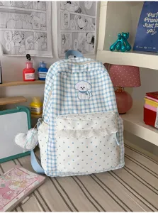 Blauw-witte ruitjes schoolrugzak met stipzak en schattige puppy borduurwerk details erin.