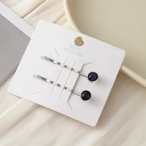 Minimalistische Metall Haarnadeln mit dunkelblauen runden Strasssteinen, elegante Haaraccessoires.