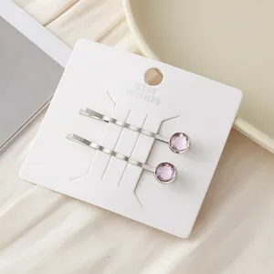 Einfache galvanisierte Metall-Haarspangen mit runden lila Kristallen, elegante Pony-Haar-Accessoires.