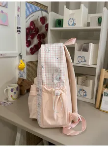 Roze ruitjes schattige schoolrugzak voor studenten, lichtgewicht grote capaciteit reis casual tas.