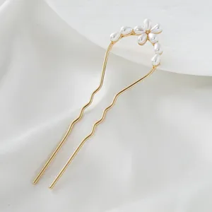 Exquisite golden U-shaped pearl hair fork detail, elegant floral design for styling buns.