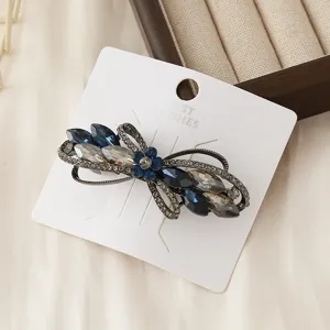 Exquisite crystal bow hair clip with sparkling rhinestones, elegant daily hair accessory.
