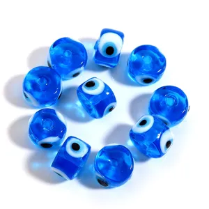 Evil eye glass bead detail shot, vibrant blue color, perfect for DIY jewelry crafting accessories.