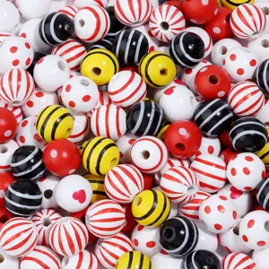 Colorful printed wooden beads with dots and stripes for DIY jewelry making crafts.