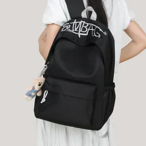 Stylish embroidered letter backpack for women, large capacity school bag and lightweight travel daypack.
