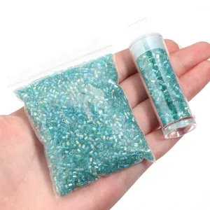 Wholesale 2mm blue tubular glass seed beads in bag and tube for DIY handmade crafting.