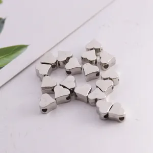 Silver heart-shaped spacer beads detail, perfect for DIY bracelet and jewelry making accessories.