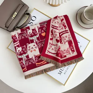 Knit winter scarf with cute cat print detail, soft cashmere feel, cozy fringe accent.