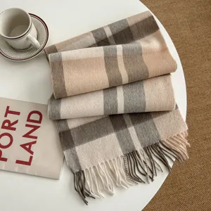 Classic plaid winter scarf with cozy fringe design, soft woolen fabric for warm and stylish daily wear.