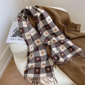 Brown and white checkered winter scarf with cute heart patterns, cozy fringe and warm fabric.