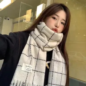 Women's winter warm plaid tassel imitation cashmere scarf, classic black and white grid style.
