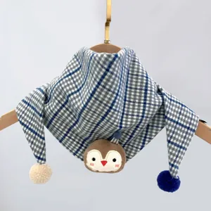 Kids blue plaid triangular scarf with cute animal plush and pom-poms, warm winter baby bib.