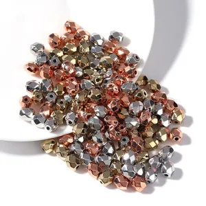 Detailed view of CCB electroplated metallic faceted rhombus barrel spacer beads for DIY jewelry.