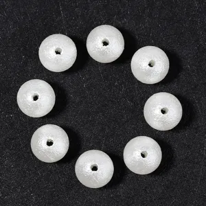 White matte faux pearl beads with center holes for DIY jewelry making and wedding accessories.