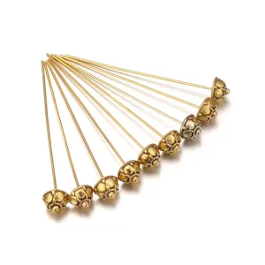 Gold alloy flower headpins for DIY jewelry making, elegant metal crafting pin findings.