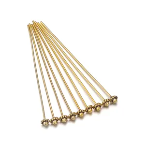 Metal alloy ball head pins for DIY jewelry making, handmade craft accessories detail shot.