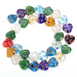Colorful millefiori glass heart beads for DIY charm bracelets and jewelry making.