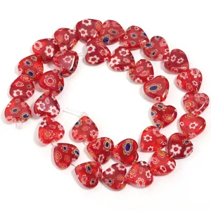 Red heart millefiori glass beads detail shot, perfect for DIY handmade bracelet jewelry design.