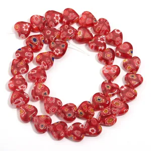 Red heart millefiori glass bead detail closeup, perfect for DIY bracelet and jewelry making.