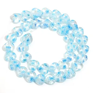 Blue millefiori glass heart beads for DIY charm bracelets and jewelry making accessories.