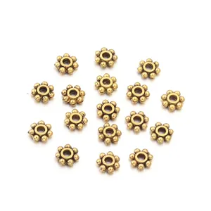 Perline distanziatrici in lega di fiori bronzo antico dettaglio, perfette per gioielli.