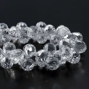 Close-up detail of clear faceted crystal glass beads for DIY jewelry making and crafting.