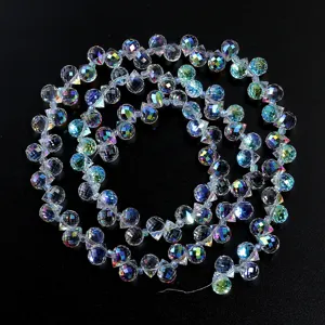 Close-up of AB coated crystal glass waterdrop loose beads, sparkling DIY jewelry accessory detail.