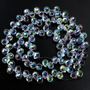Faceted crystal waterdrop beads detail showing vibrant AB coating colors and sparkling cuts.