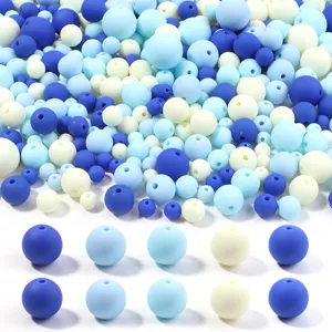 Close-up detail of 6-16mm acrylic rubber paint round beads in blue and cream for DIY craft jewelry.