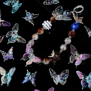 Acrylic iridescent butterfly DIY phone charm pendant and beaded strap accessory detail view.