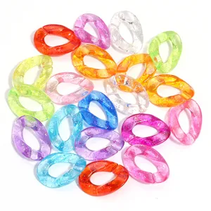 Detail view of colorful glitter acrylic open loop chain links for DIY jewelry accessories.