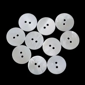 Detail view of natural white mother of pearl two-hole buttons for shirts and knitwear.