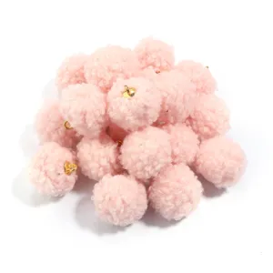 Pink teddy fleece pom pom charms with gold loops, perfect for DIY earrings and bag accessories.